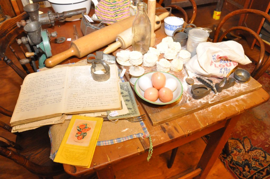 Kitchen table with items used for cooking.
